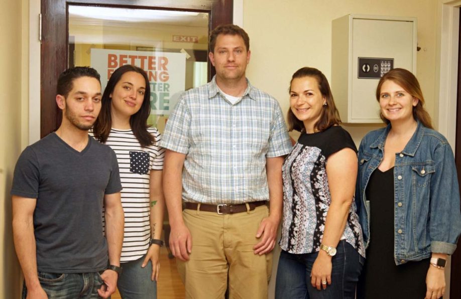 People standing in the office for a picture