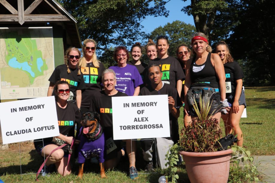 Group posing at outdoor memorial gathering