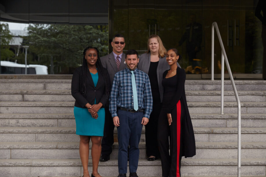 Group of people standing on the stairs for a picture